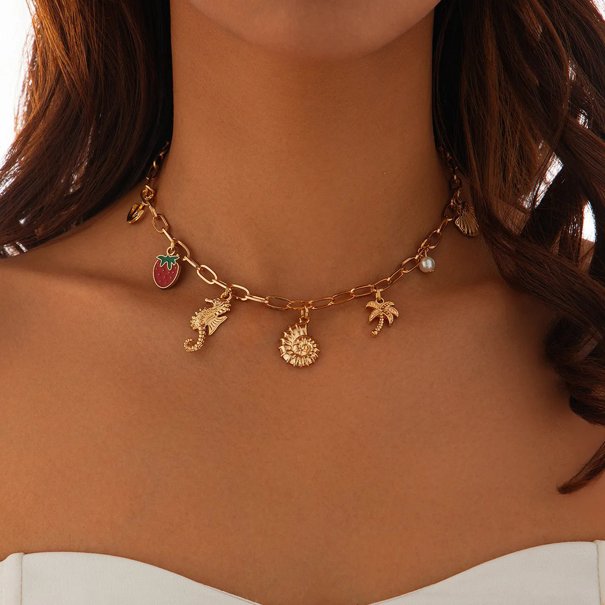 Collier breloque coquillage doré