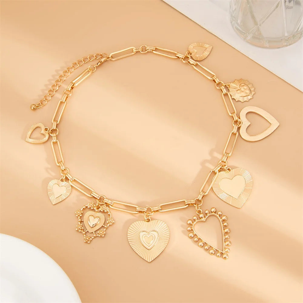 Collier breloques gros coeurs dorés
