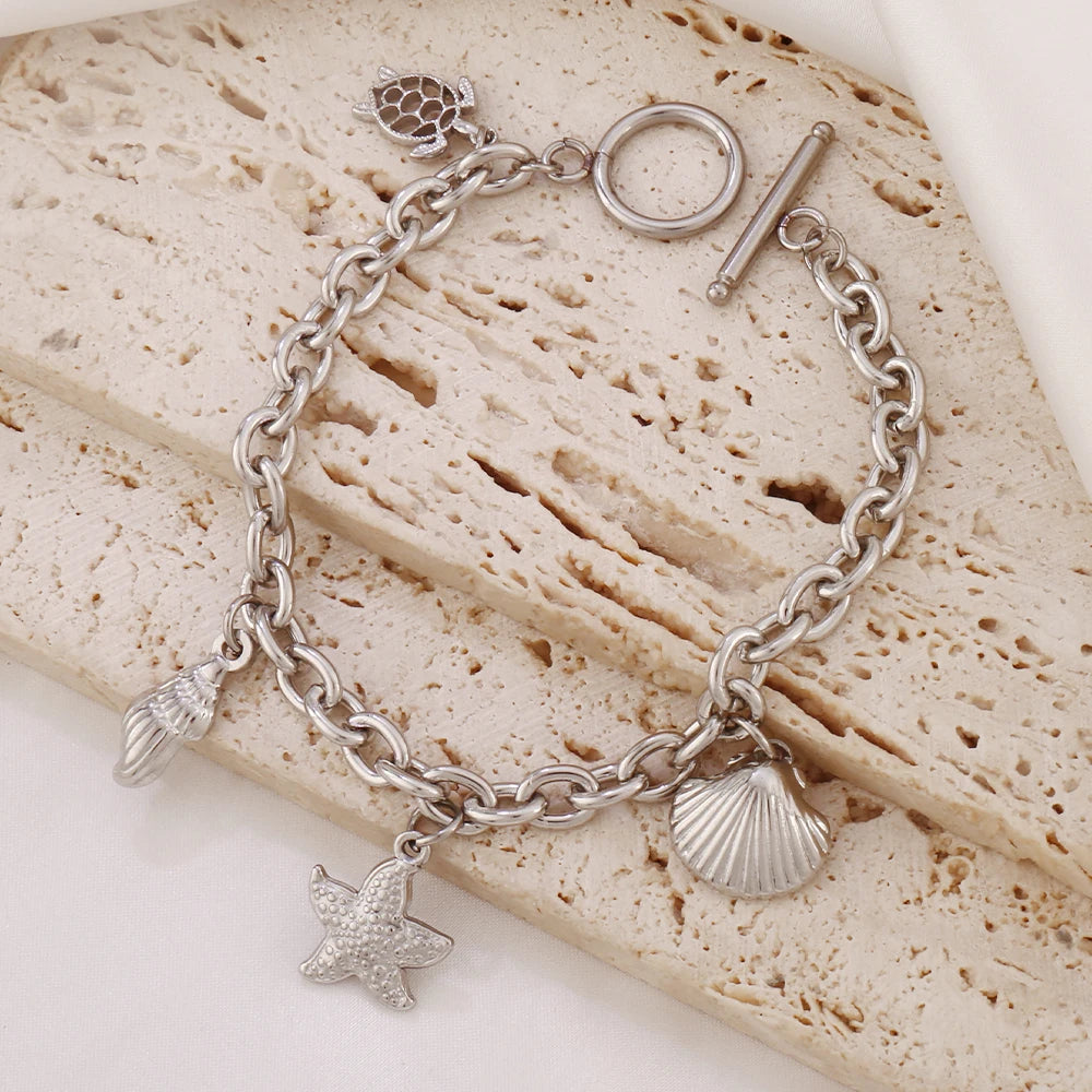 Bracelet breloques avec étoile de mer argenté à bascule