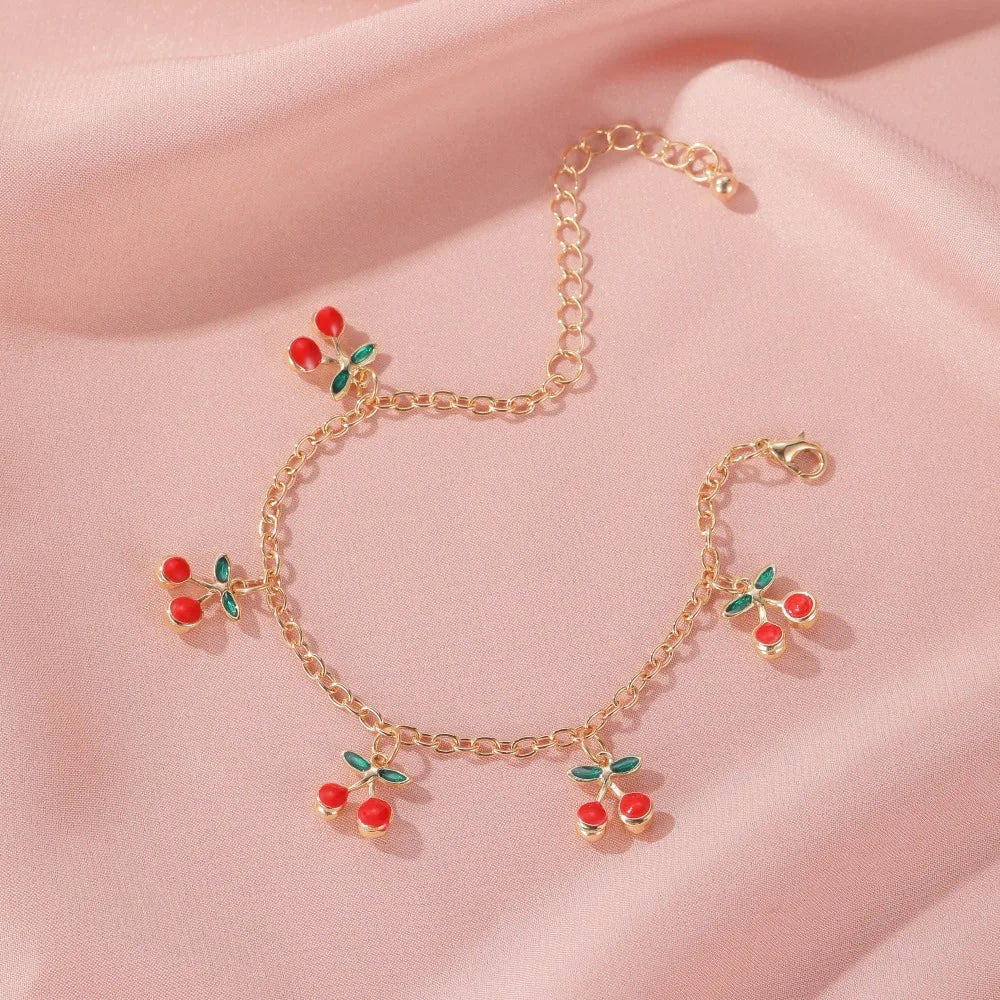 Bracelet à breloques cerises doré
