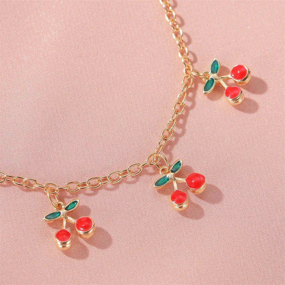 Bracelet à breloques cerises doré