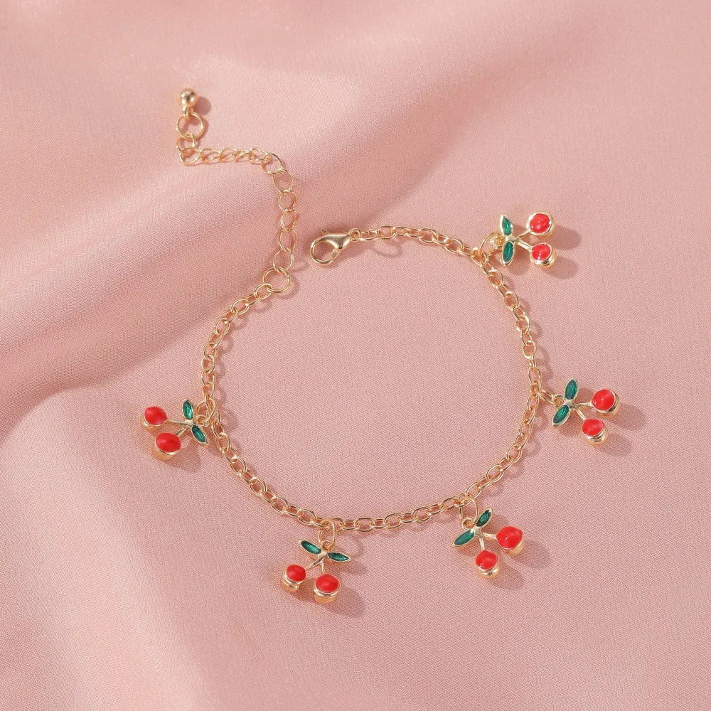 Bracelet à breloques cerises doré