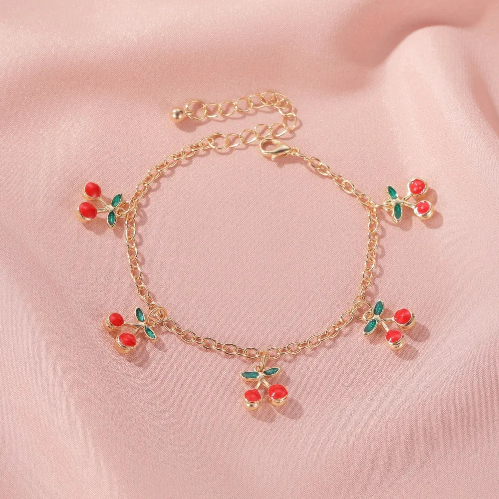 Bracelet à breloques cerises doré