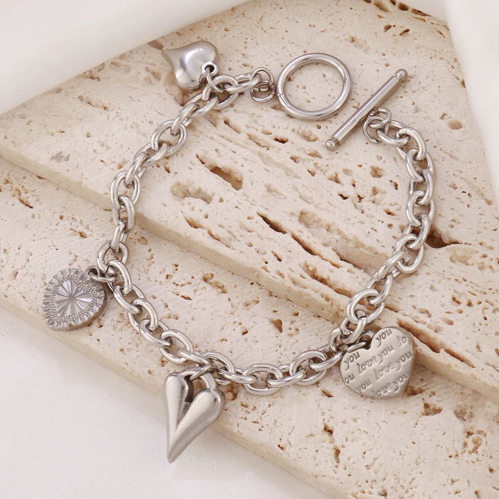 Bracelet breloques avec coeur argenté à bascule