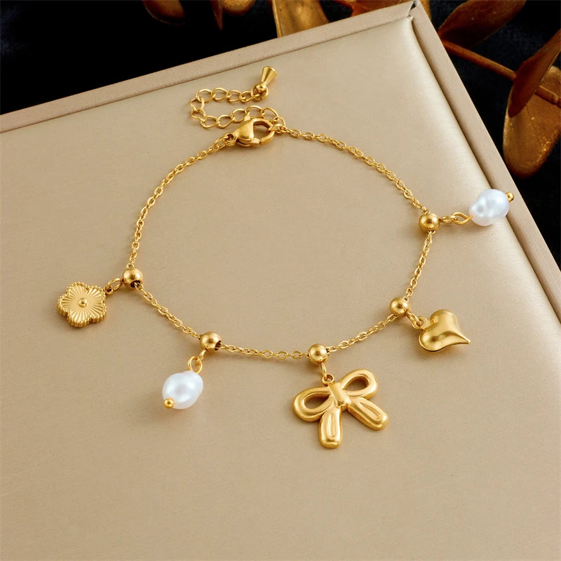 Bracelet breloques noeud papillon doré