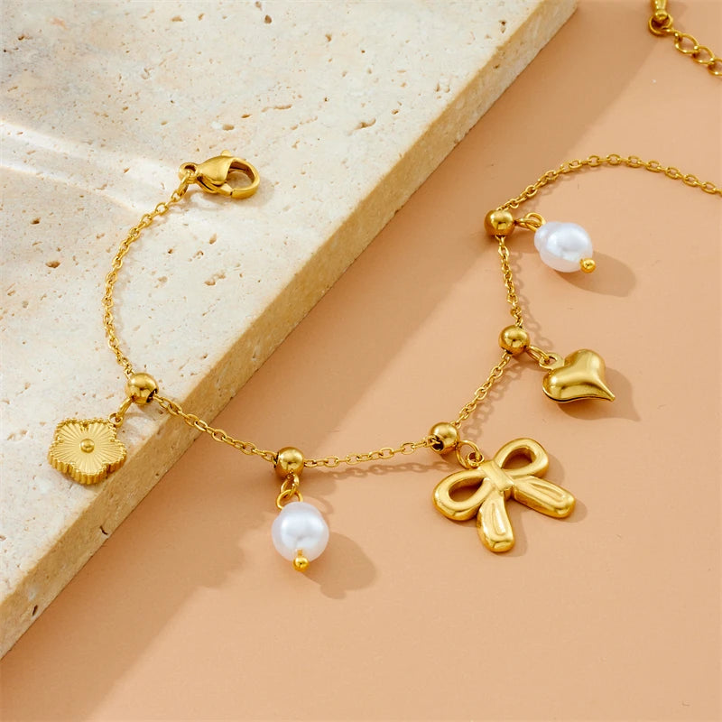 Bracelet breloques noeud papillon doré
