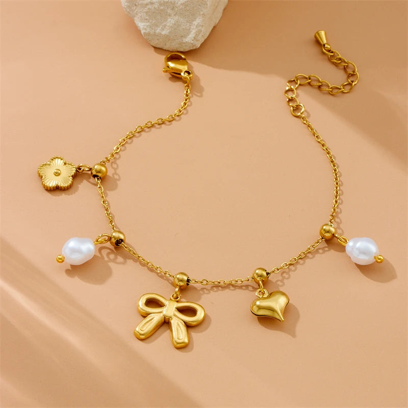 Bracelet breloques noeud papillon doré