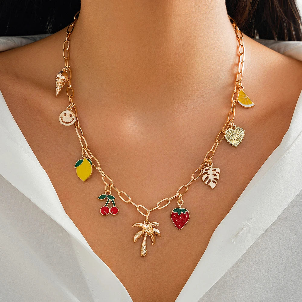 Collier à breloques doré avec palmier