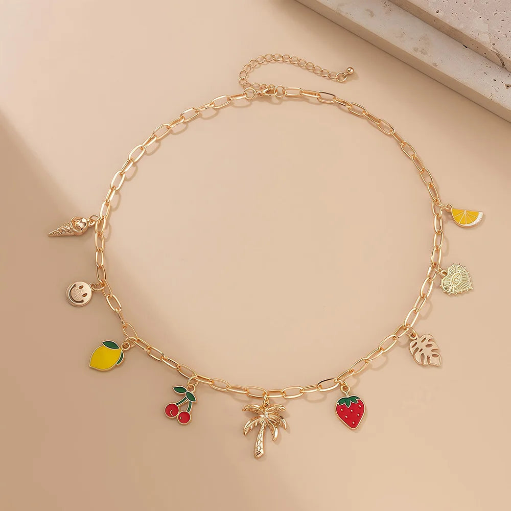 Collier à breloques doré avec palmier