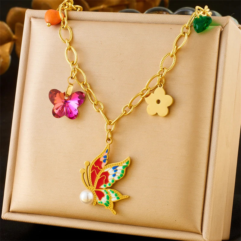 Collier à breloques doré et fée