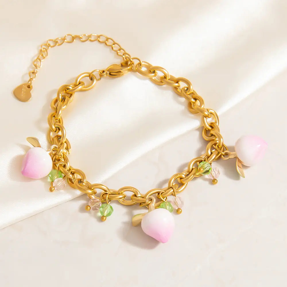Bracelet à breloques pendantes pêches roses