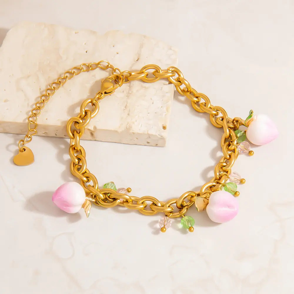 Bracelet à breloques pendantes pêches roses
