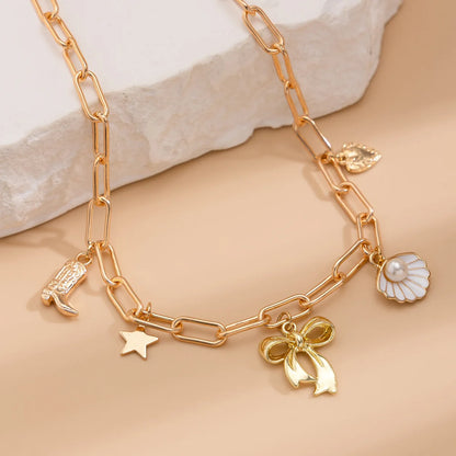 Collier breloque noeud papillon doré