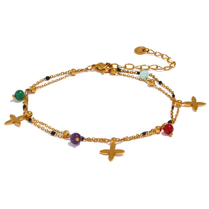 Bracelet à breloques croix dorées et pierres naturelles