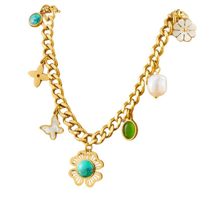 Collier à breloques doré multiples avec fleur