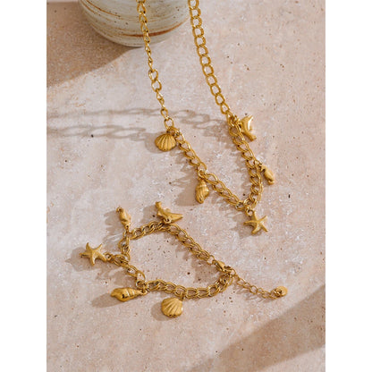 Collier breloques de la mer dorées