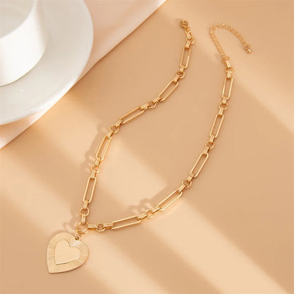 Collier breloque gros coeur doré