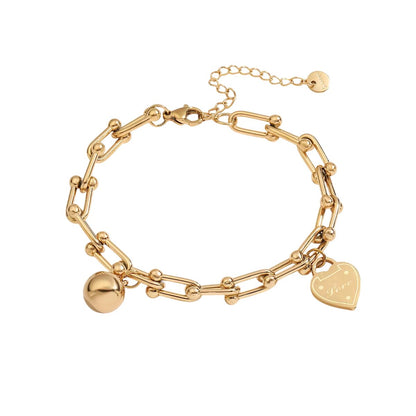 Bracelet breloques doré avec coeur à chaîne