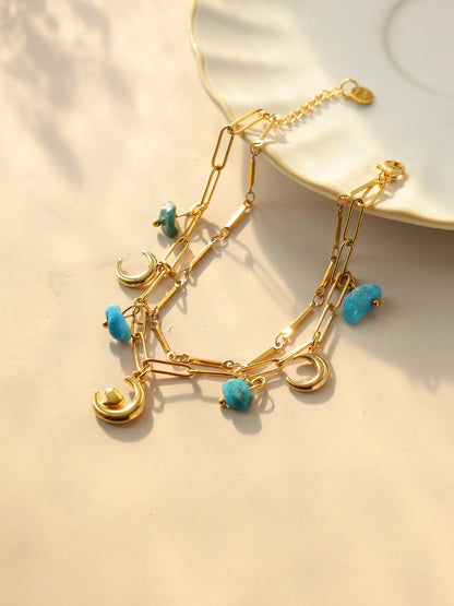 Bracelet à breloques avec lune et coeur doré