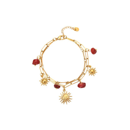 Bracelet à breloques avec soleil et pierres rouges