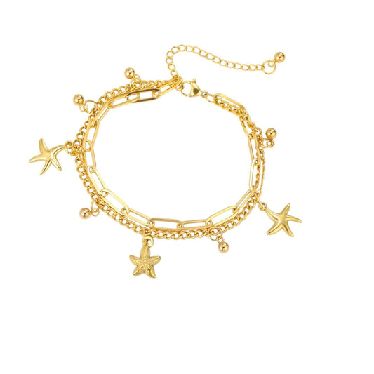 Bracelet à breloques étoiles de mer multiples doré