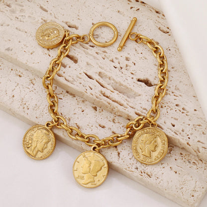 Bracelet breloques avec médailles doré à bascule