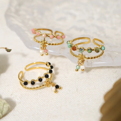 Bague à breloques blanches et roses dorée