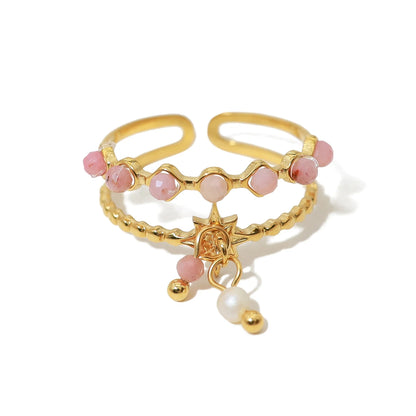 Bague à breloques blanches et roses dorée