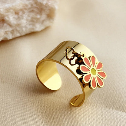 Bague breloque ajustable à fleur rouge et dorée
