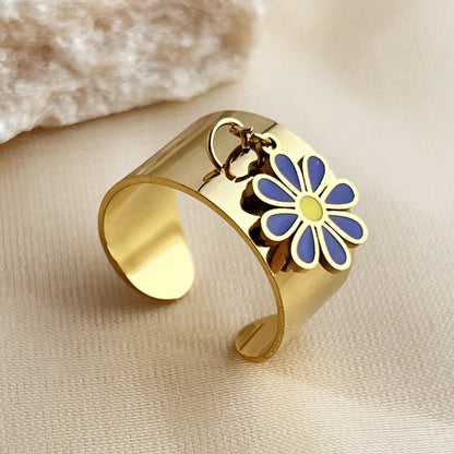 Bague breloque ajustable à fleur bleue et dorée