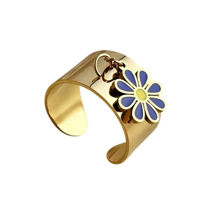 Bague breloque ajustable à fleur bleue et dorée