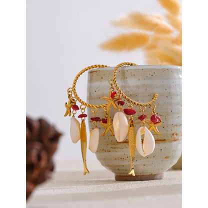 Boucles d'oreilles coquillages dorées