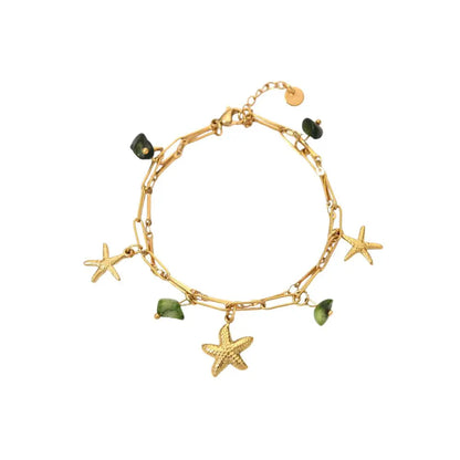 Bracelet à breloques avec étoile de mer et pierres vertes