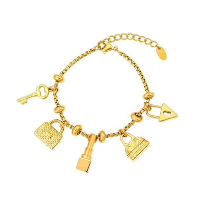 Bracelet à breloques doré avec clips et cadenas