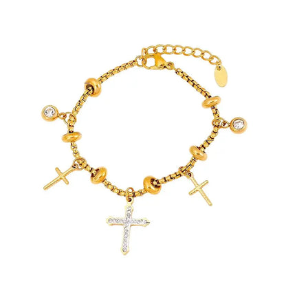 Bracelet à breloques doré avec clips et croix