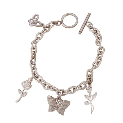 Bracelet breloques avec papillon argenté à bascule