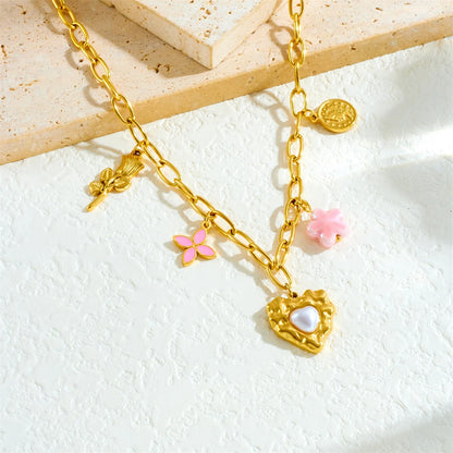 Collier à breloques avec coeur nacré doré