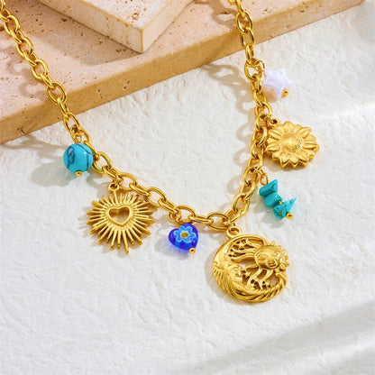 Collier à breloques avec lune et soleil doré
