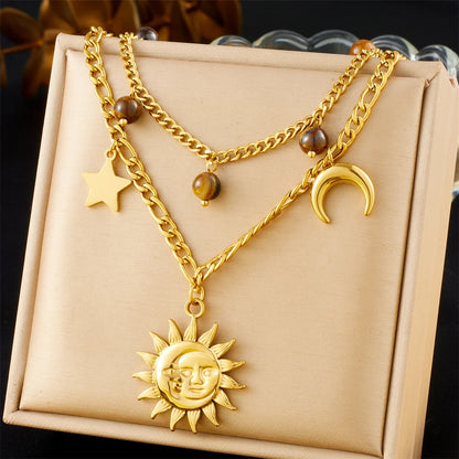 Collier à breloques avec soleil, lune et étoile doré