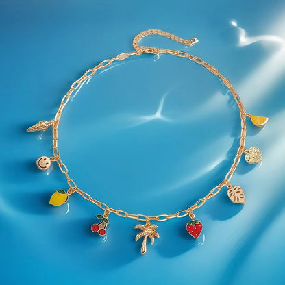 Collier à breloques doré avec palmier