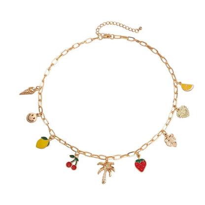 Collier à breloques doré avec palmier