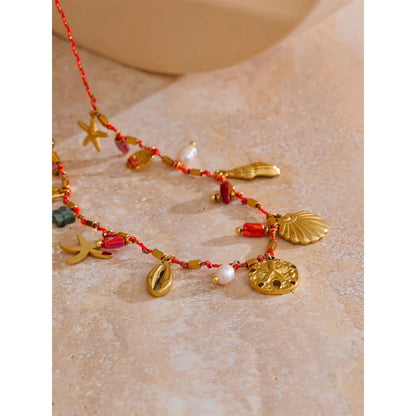 Collier breloques coquillages dorés