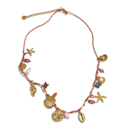 Collier breloques coquillages dorés