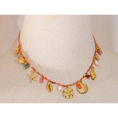 Collier breloques coquillages dorés