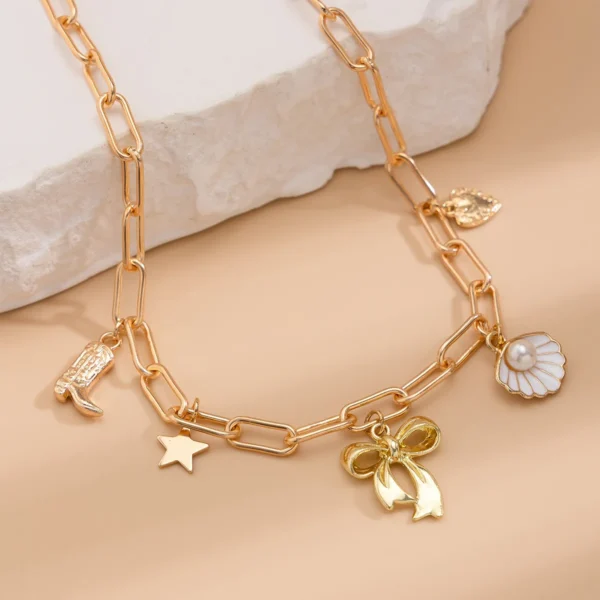 Collier breloque noeud papillon doré