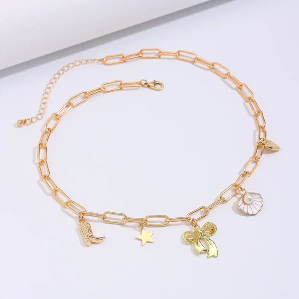 Collier breloque noeud papillon doré